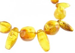 Beads made of figured amber stones